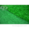 Syntetisk gressgolf som setter grønt med golfflagg